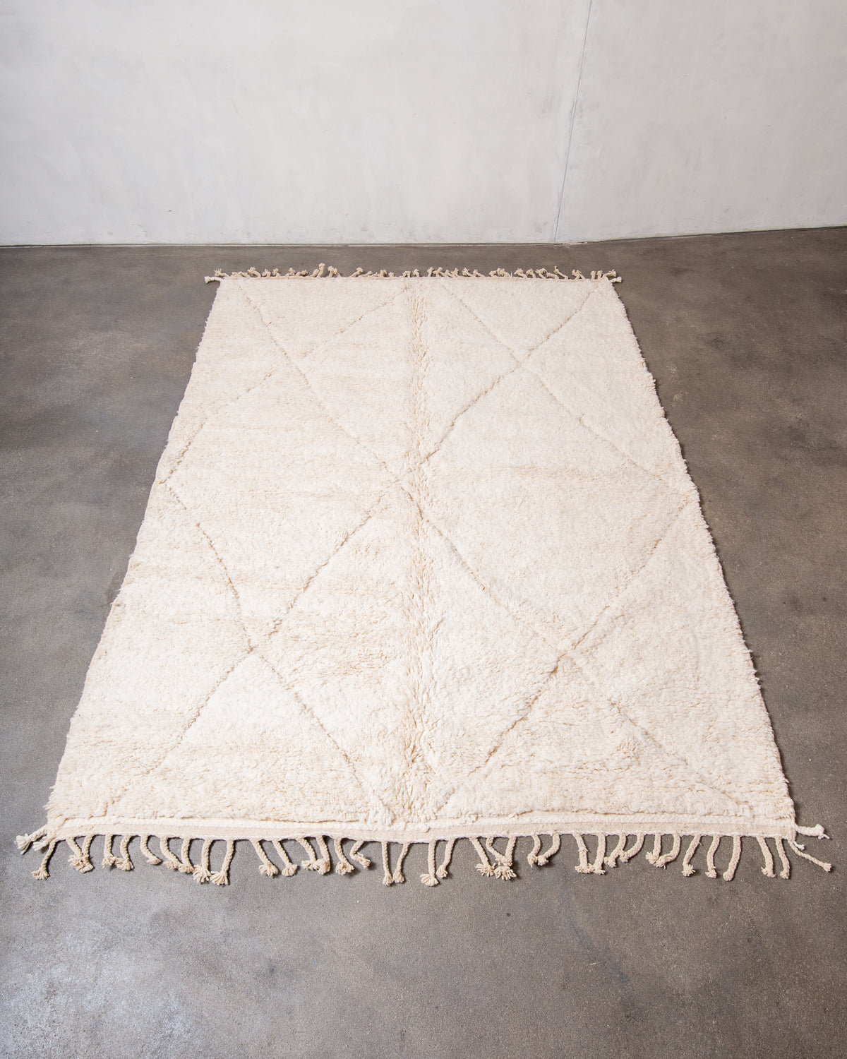 Modern, designer, handcrafted Berber rug from Morocco. Beniourain carpet with minimalist design, natural wool pile and a fluffy texture.